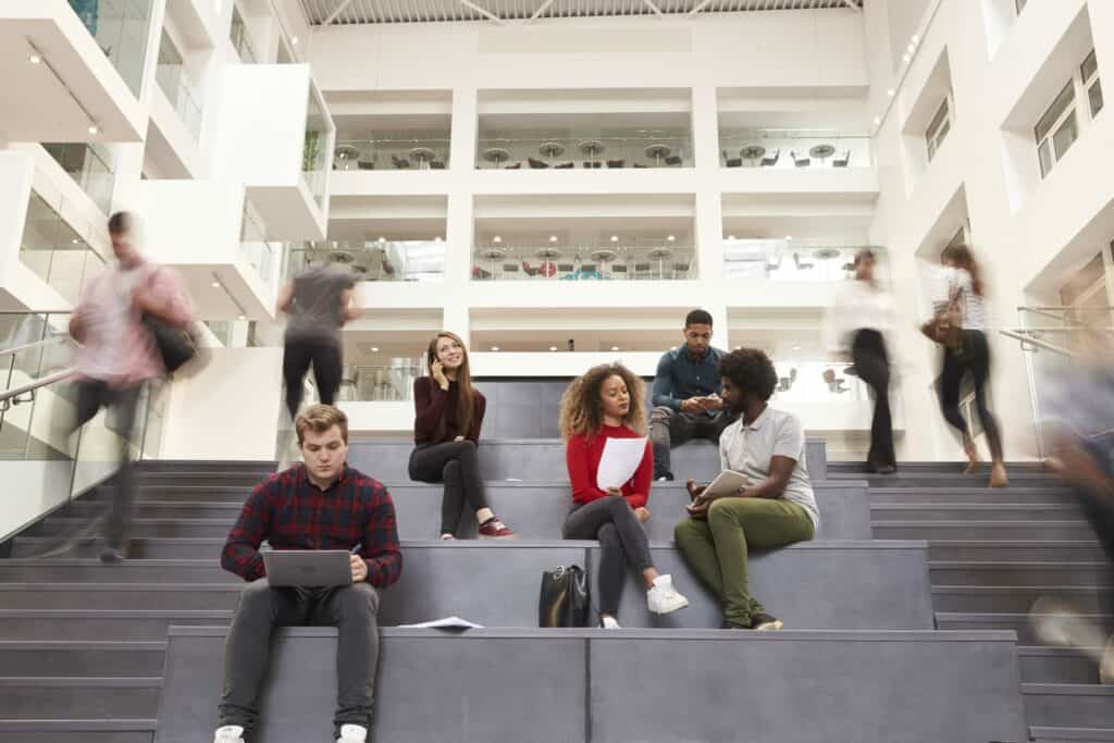 People working and socialising in a busy office environment